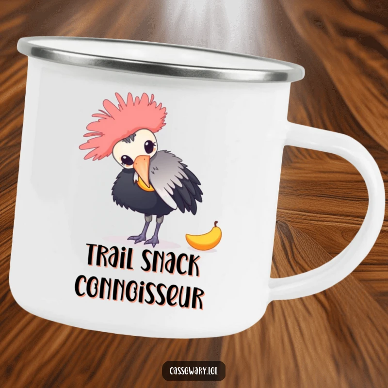 Funny camping mug featuring a cassowary playfully nudging a fallen mango, ideal for outdoor adventures and humorous sipping.