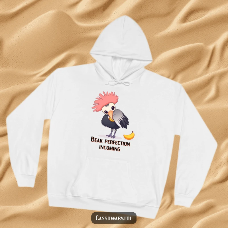 Funny hoodie featuring a cassowary playfully nudging a fallen mango, illustrating a humorous jungle scene for ultimate warmth and style.