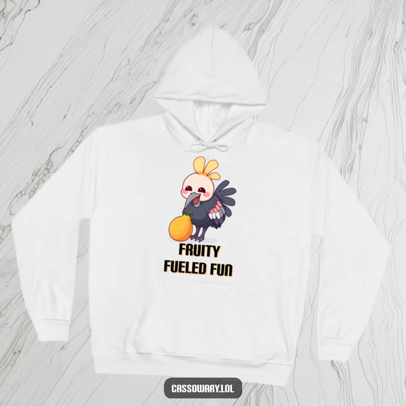 Funny hoodie depicting a kawaii cassowary joyfully pecking at a small, colorful fruit, radiating happiness and a love for deliciousness.