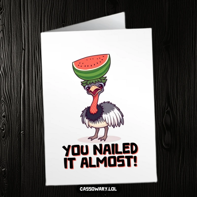 Funny free printable congratulations card, featuring a cassowary comically trying to balance a watermelon on its head.