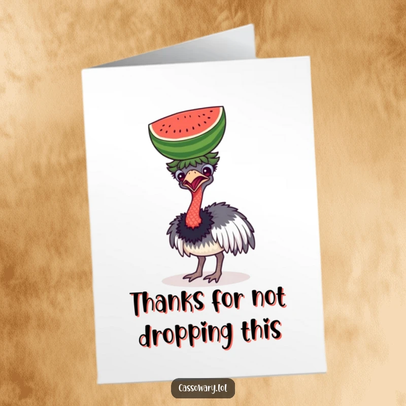 A funny free printable thank you card depicts a cassowary comically attempting to balance a large watermelon on its head.