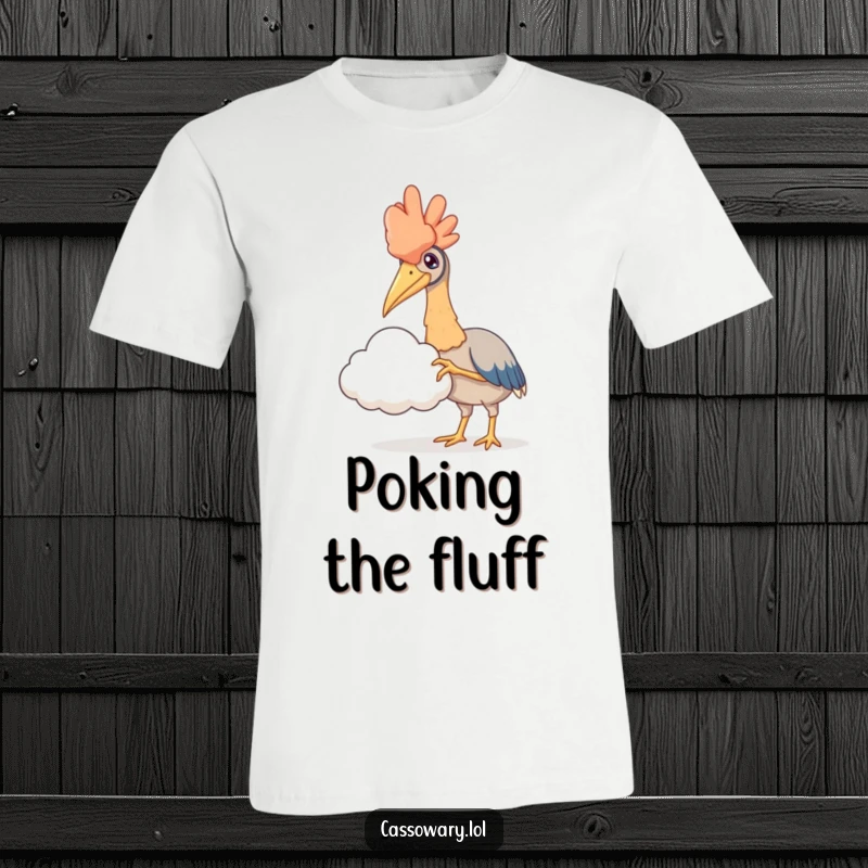 Funny t-shirt featuring a cassowary with its claw outstretched, delicately trying to touch a fluffy cloud, embodying sweet fantasy.