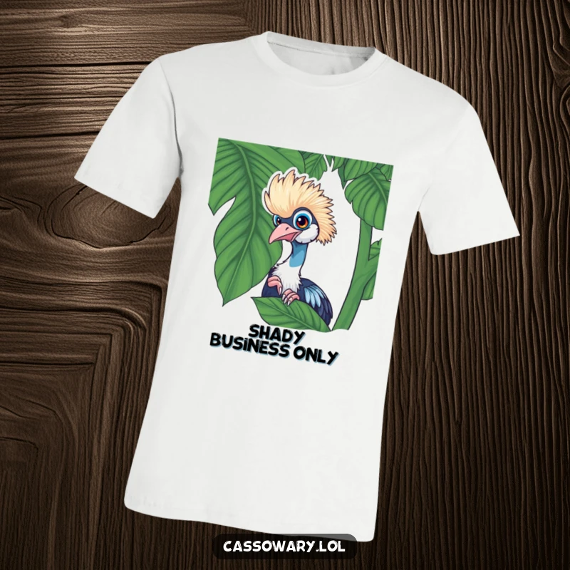 Funny cassowary t-shirt graphic of a cassowary playfully peeking from behind a lush tropical leaf, with a mischievous look.
