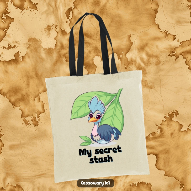Funny cassowary tote bag featuring a cheerful bird peeking from behind a large leaf, perfect for carrying essentials with charm.